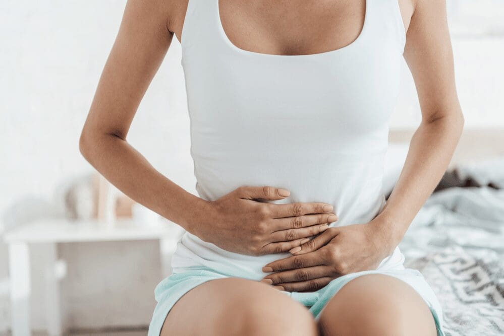 woman-having-stomach-issues-putting-hands-on-her-stomach